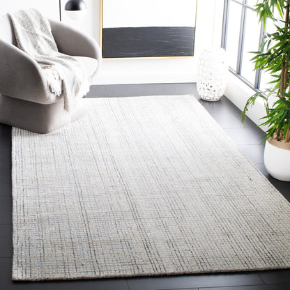 SAFAVIEH Handmade Abstract Marikka Modern Viscose Rug