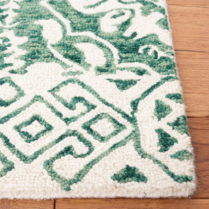 SAFAVIEH Handmade Dip Dye Elvedina Floral Wool Rug