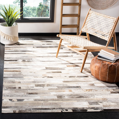 SAFAVIEH Handmade Studio Leather Tennille Modern Leather Rug