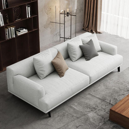 Canapé droit en tissu beige à accoudoirs carrés